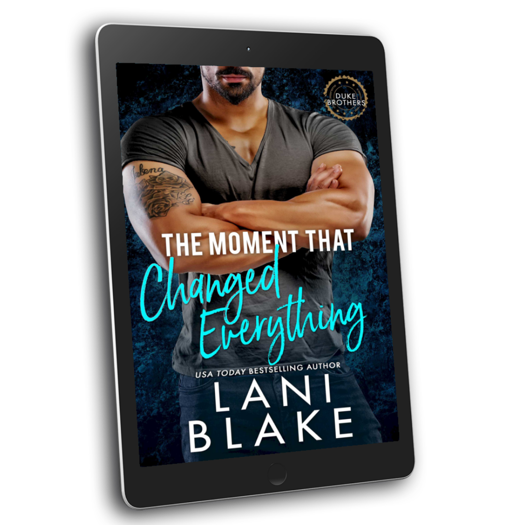 Image of a small town romance book cover on a tablet. The man has a tattoo on his arm and is wearing jeans and a tshirt.